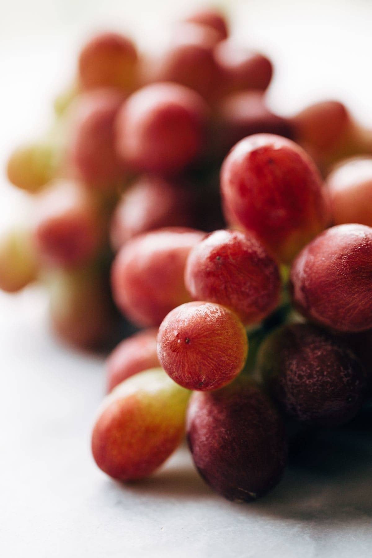 Caramelized Shallot and Grape Chutney! Made with shallots, grapes, red wine, cinnamon, bourbon, and vinegar. So good with plate of crispy crackers! | pinchofyum.com
