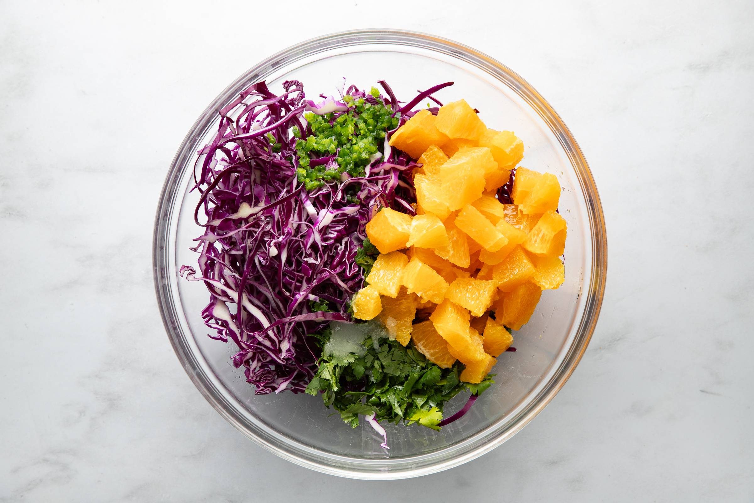 Orange salsa ingredients in a bowl.