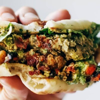 Naan-wich held by hand.