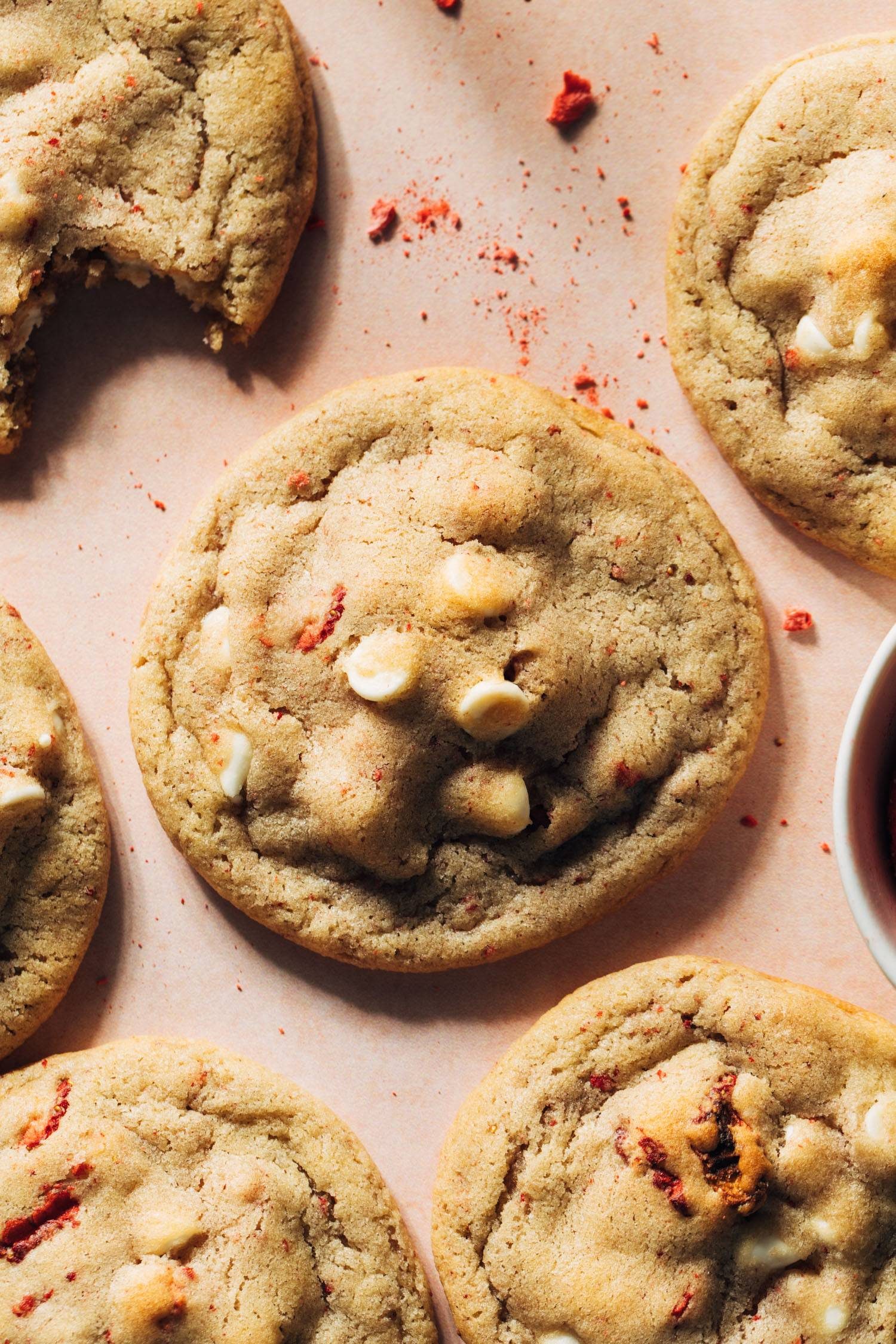 Strawberry white chocolate cookies on a pink background