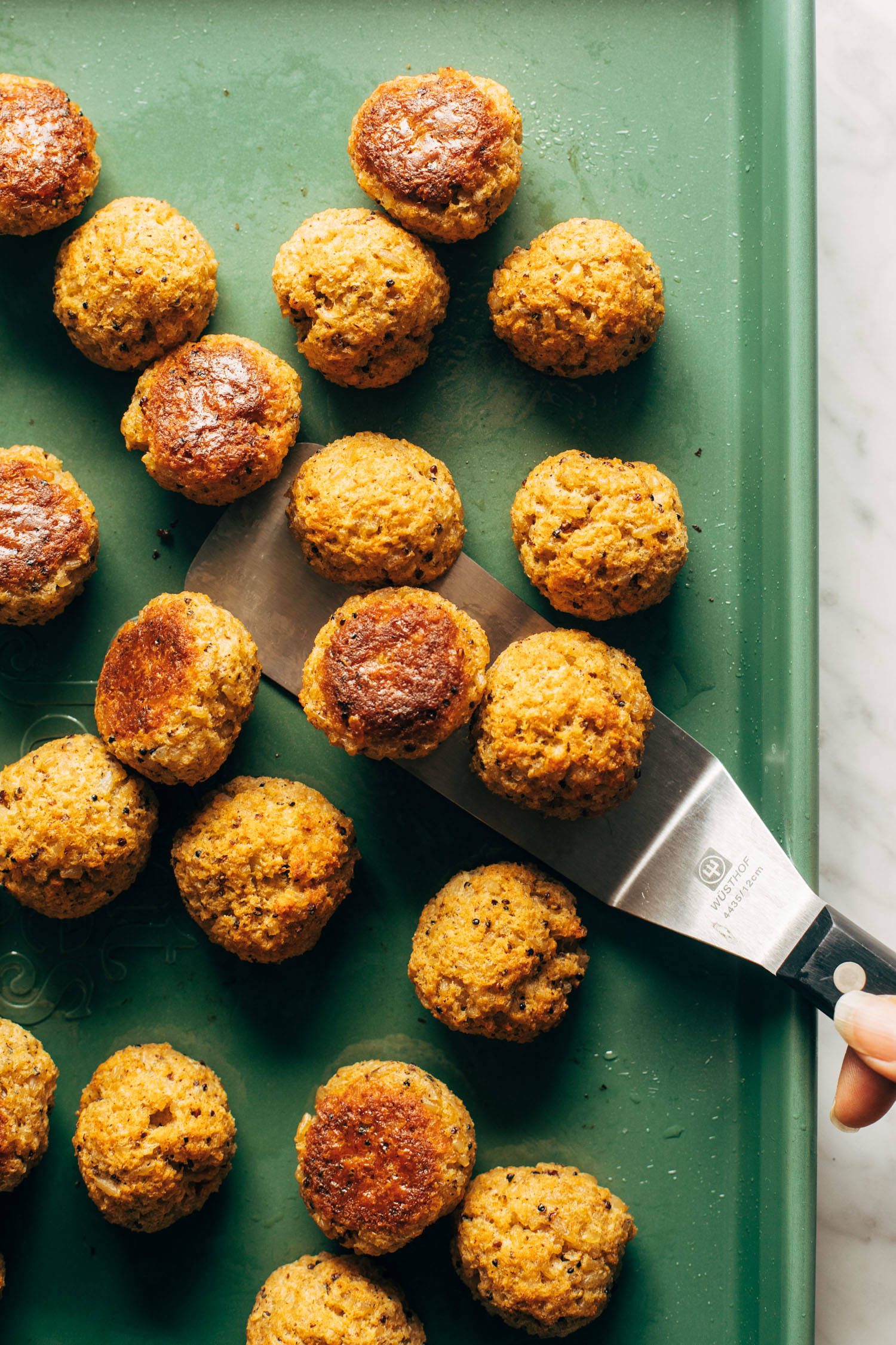 Vegetarian meatballs on a sheet pan.